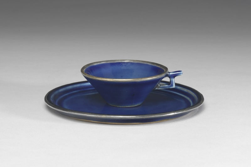 Single-handled cup and saucer with cobalt blue glaze