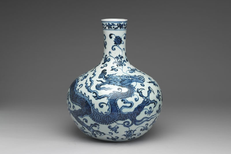 Celestial globe vase with decoration of dragon among lotus blossoms in underglaze blue