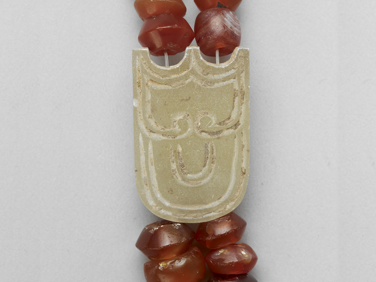 Jade shield-shaped plaque of the necklace