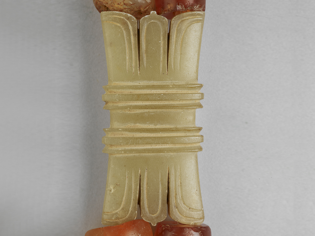 Jade girdle-shaped plaque of the necklace